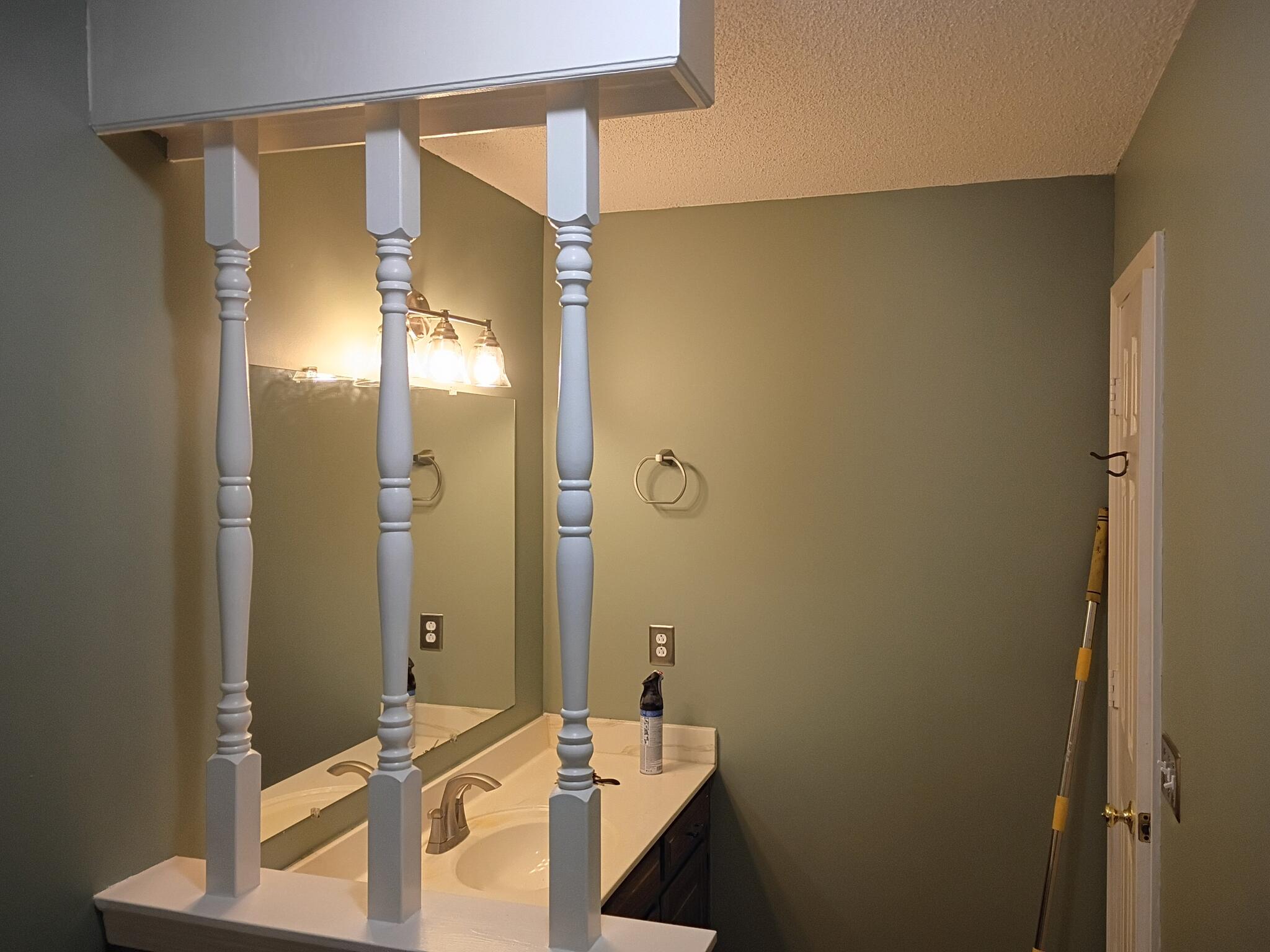 Bathroom vanity area after fixture and wall work